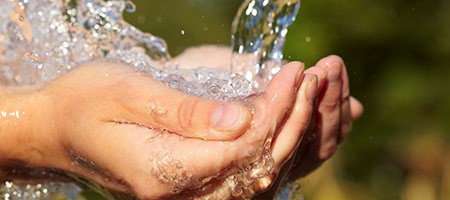 Hands Holding Water, Symbolizing a Healing Place Church