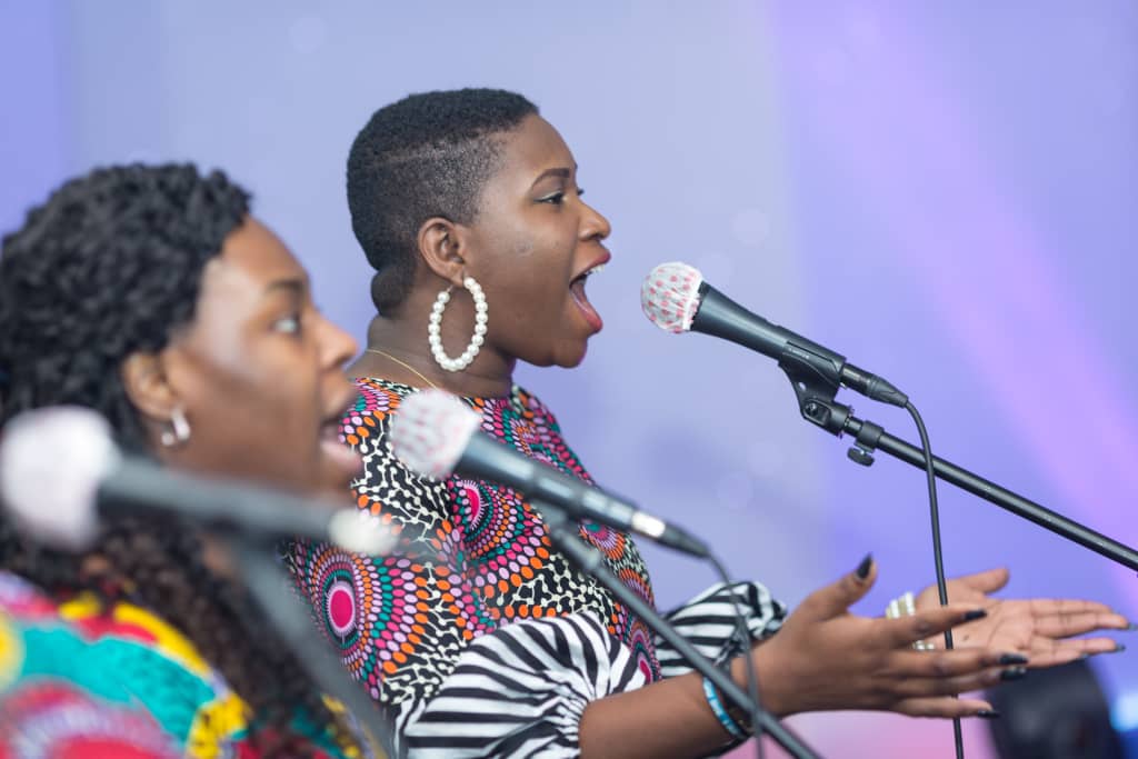 Multiple Women Singing at the OFM Church in Houston, TX